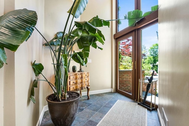 34 Lagrange St, Brookline, MA 02467 - doorway to outside featuring healthy amount of natural light and stone tile flooring
