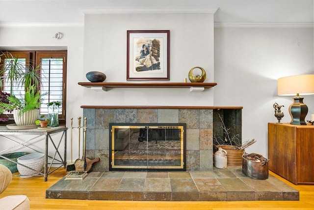 34 Lagrange St, Brookline, MA 02467 - detailed view of crown molding, a tile fireplace, and wood finished floors