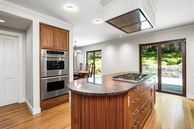 34 Lagrange St, Brookline, MA 02467 - kitchen featuring appliances with stainless steel finishes, light wood-type flooring, crown molding, brown cabinets, and recessed lighting
