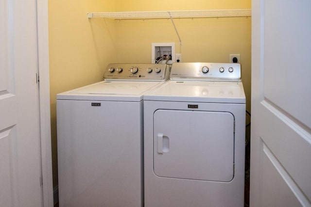 washroom with washer and dryer and laundry area