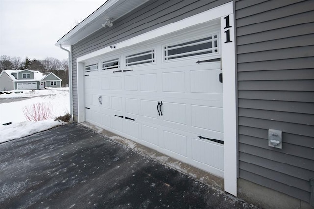 view of snow covered garage