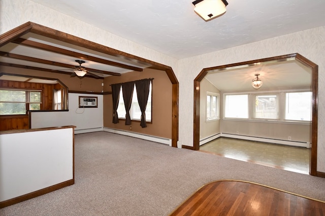 unfurnished living room featuring a baseboard heating unit, carpet flooring, and ceiling fan