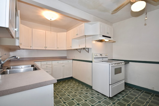 kitchen with sink, white range with electric cooktop, white cabinets, and ceiling fan