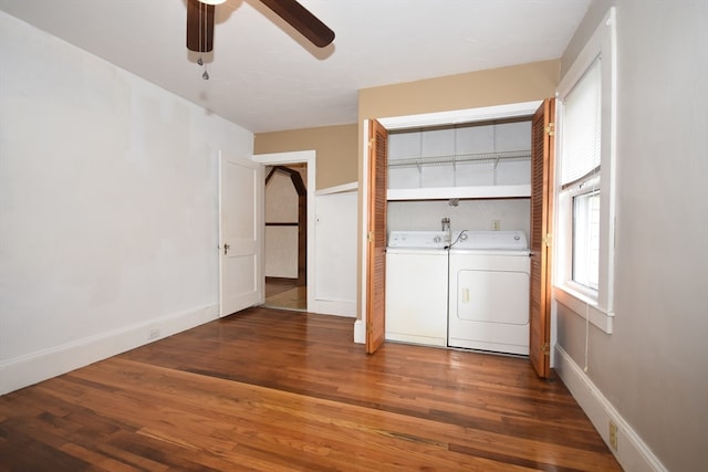 interior space with dark wood-type flooring, independent washer and dryer, and ceiling fan