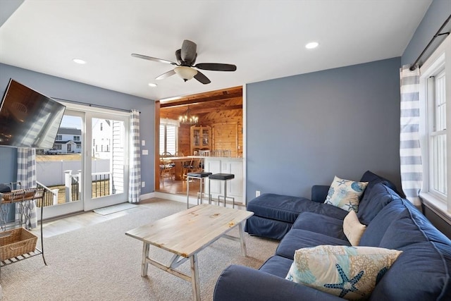 10 Chadwell Ave, Sandwich, MA 02563 - carpeted living room featuring ceiling fan with notable chandelier, recessed lighting, baseboards, and a healthy amount of sunlight