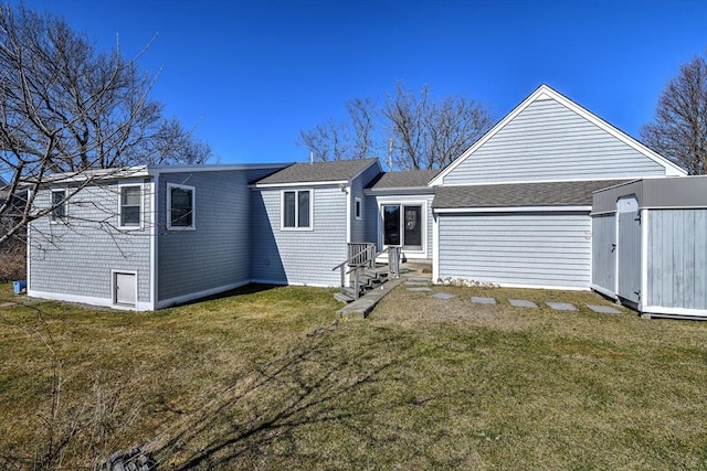 10 Chadwell Ave, Sandwich, MA 02563 - rear view of house with a yard and roof with shingles