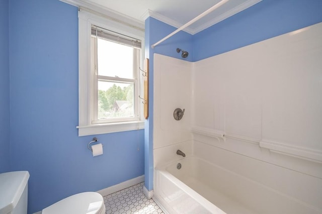 bathroom featuring toilet, ornamental molding, baseboards, and tub / shower combination