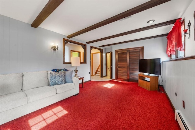 carpeted living area featuring beam ceiling, visible vents, stairway, and baseboard heating