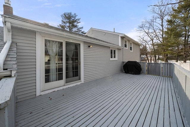 wooden terrace featuring grilling area