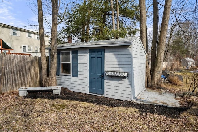 view of shed with fence