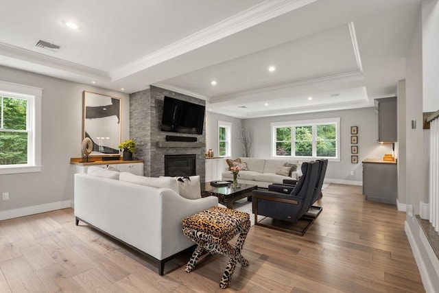 35 E St, Middleton, MA 01949 - living room with ornamental molding, a raised ceiling, plenty of natural light, light wood-style flooring, and recessed lighting