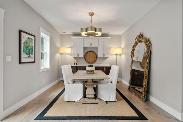 35 E St, Middleton, MA 01949 - dining space featuring light wood-style floors and a chandelier