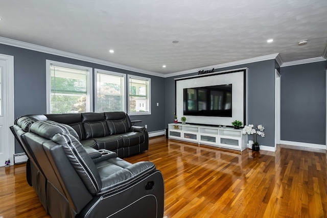 living room featuring ornamental molding, wood-type flooring, and a baseboard radiator