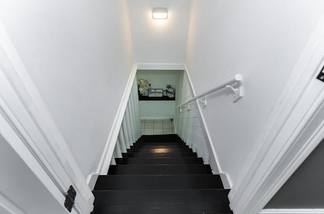 staircase featuring wood finished floors