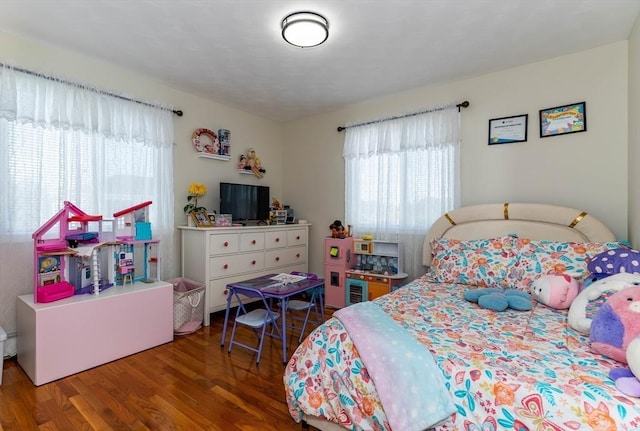 bedroom with wood finished floors