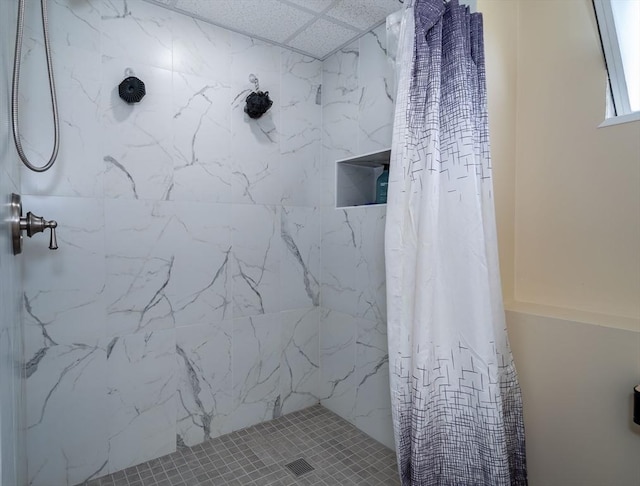 bathroom featuring a shower stall