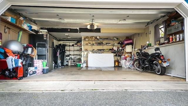 garage featuring a garage door opener