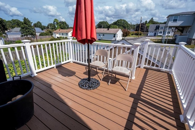 wooden deck with a residential view