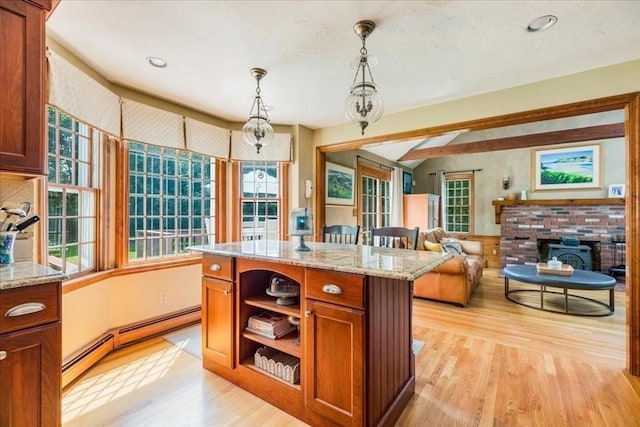 11 Tara Dr, Pembroke, MA 02359 - kitchen featuring light wood finished floors, baseboard heating, pendant lighting, brown cabinetry, and plenty of natural light