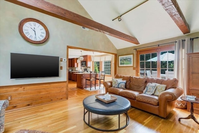 11 Tara Dr, Pembroke, MA 02359 - living room with light wood-style flooring, plenty of natural light, beamed ceiling, and high vaulted ceiling