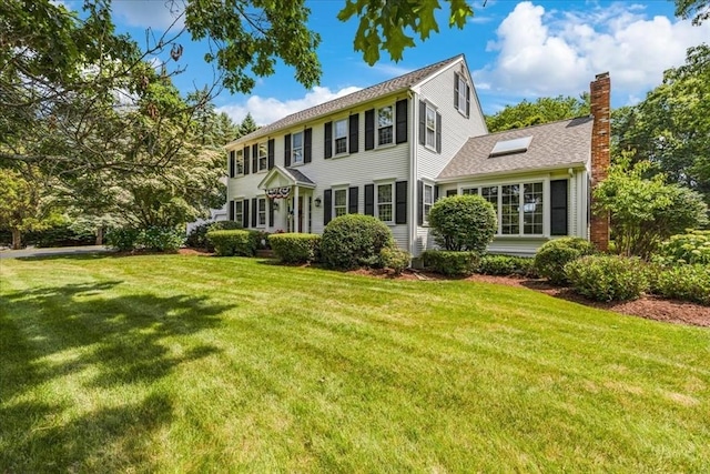 11 Tara Dr, Pembroke, MA 02359 - view of front facade with a chimney and a front yard