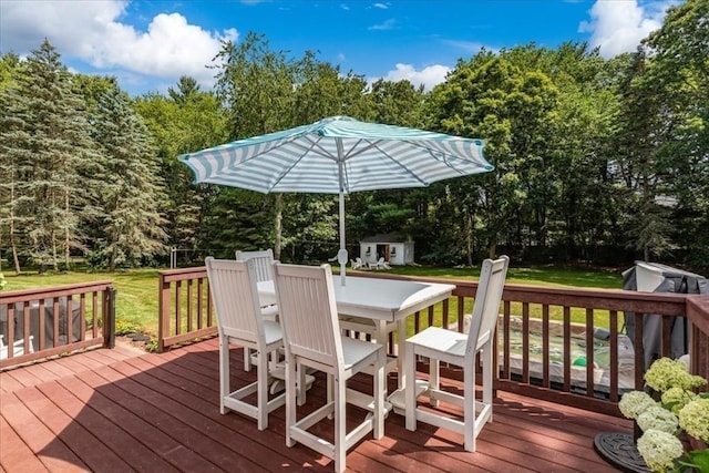 11 Tara Dr, Pembroke, MA 02359 - deck with a storage shed, outdoor dining area, a yard, and view of wooded area