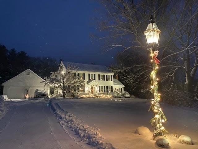 11 Tara Dr, Pembroke, MA 02359 - view of front of home with a garage and asphalt driveway