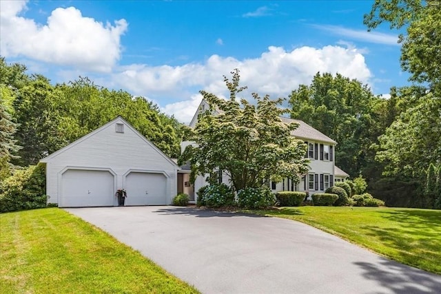 11 Tara Dr, Pembroke, MA 02359 - colonial home with asphalt driveway, an attached garage, and a front yard