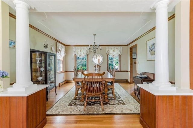 11 Tara Dr, Pembroke, MA 02359 - dining area featuring decorative columns, light wood-style flooring, ornamental molding, and a chandelier