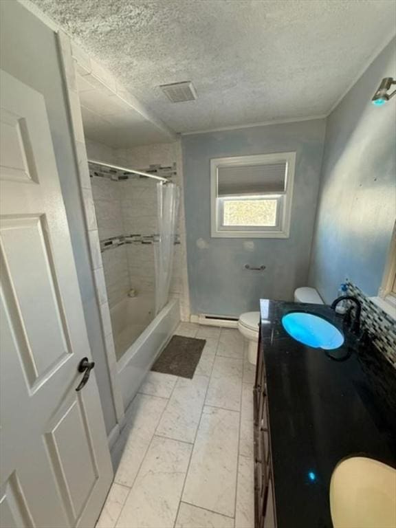 bathroom featuring a textured ceiling, toilet, and vanity