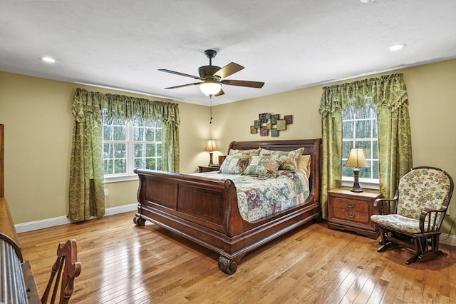 bedroom with light wood-style floors, recessed lighting, ceiling fan, and baseboards