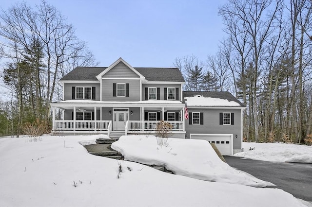 view of front of property with covered porch, driveway, and an attached garage