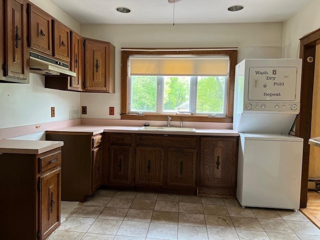 318 Holden St, Holden, MA 01520 - kitchen with stacked washer / drying machine, a sink, light countertops, under cabinet range hood, and light tile patterned flooring
