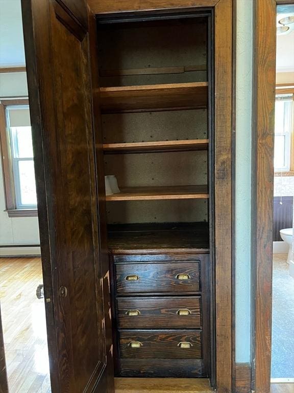 318 Holden St, Holden, MA 01520 - detailed view of a baseboard heating unit and wood finished floors