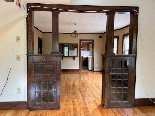 318 Holden St, Holden, MA 01520 - corridor featuring decorative columns, hardwood / wood-style flooring, baseboards, crown molding, and a textured wall