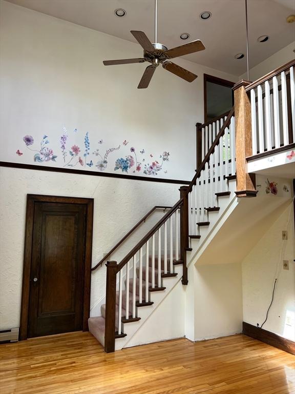 318 Holden St, Holden, MA 01520 - stairway with wood finished floors, ceiling fan, and recessed lighting