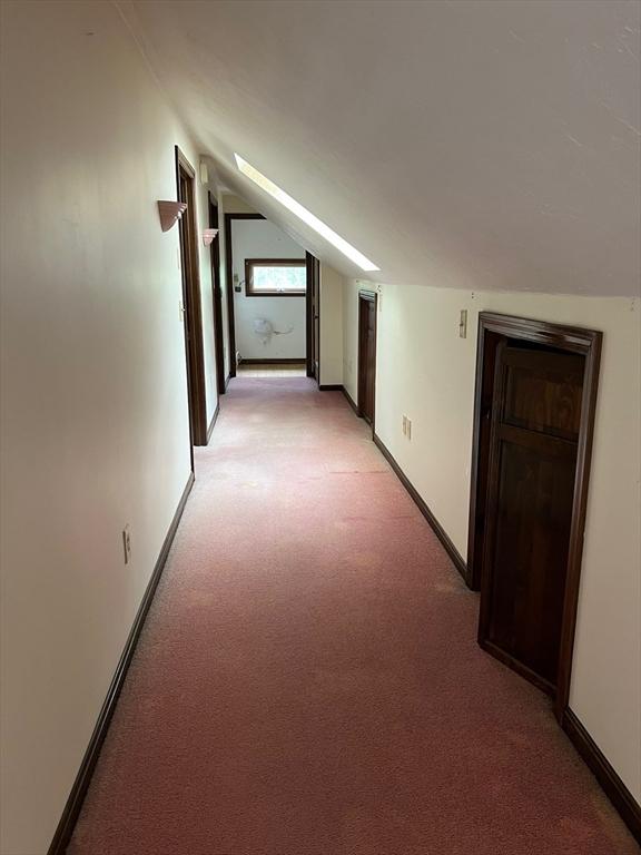 318 Holden St, Holden, MA 01520 - hall featuring light colored carpet, vaulted ceiling, and baseboards