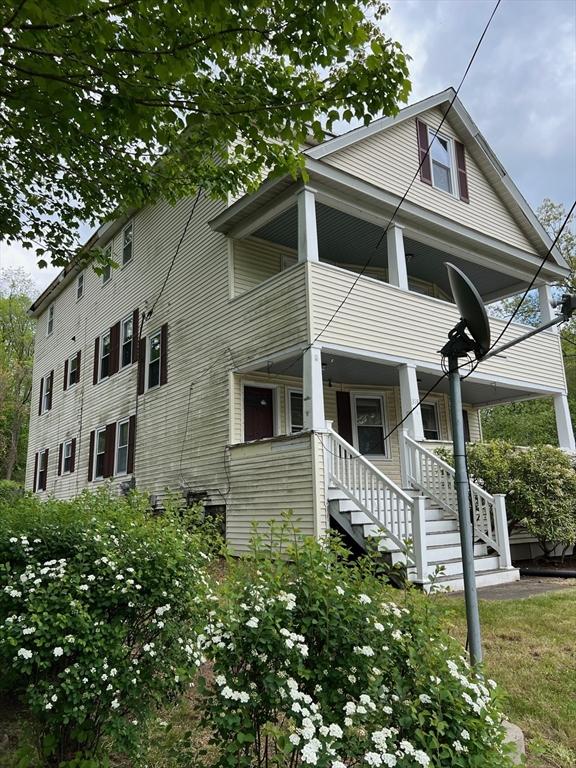 318 Holden St, Holden, MA 01520 - view of front of property with a balcony, a porch, and stairway