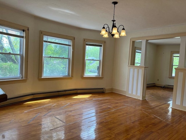 318 Holden St, Holden, MA 01520 - unfurnished room featuring healthy amount of natural light, a chandelier, a baseboard radiator, wood-type flooring, and crown molding