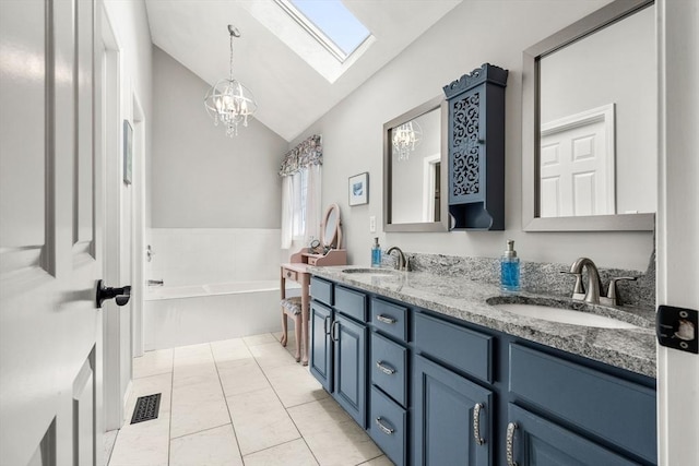 67 Hillside St, Rowley, MA 01969 - full bath featuring a skylight, lofted ceiling, double vanity, a bath, and a chandelier