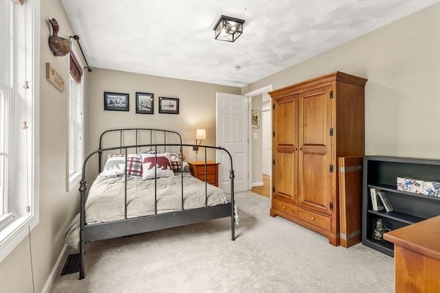 67 Hillside St, Rowley, MA 01969 - bedroom with multiple windows, light colored carpet, and baseboards