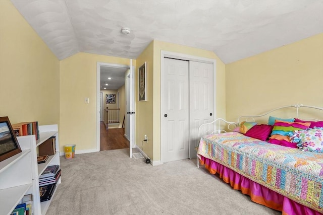 67 Hillside St, Rowley, MA 01969 - carpeted bedroom with vaulted ceiling, a closet, and baseboards