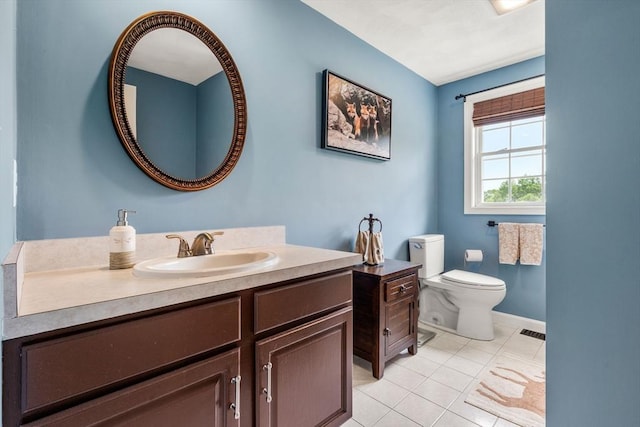 67 Hillside St, Rowley, MA 01969 - bathroom with vanity, toilet, tile patterned floors, and baseboards