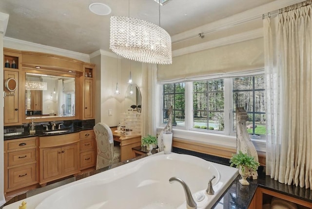 full bath with vanity, ornamental molding, a bath, and a chandelier
