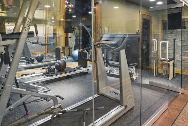 gym featuring wood finished floors