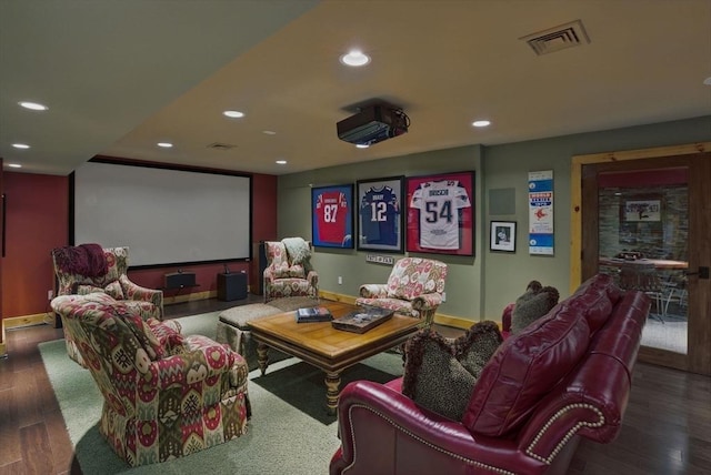 home theater with recessed lighting, baseboards, visible vents, and wood finished floors