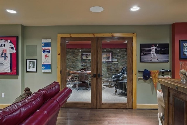 interior space featuring baseboards, recessed lighting, french doors, and wood finished floors