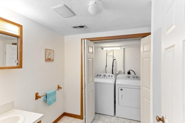 23 Indian Cove Way Unit 23, Easton, MA 02375 - laundry area featuring washer and dryer and light tile patterned flooring