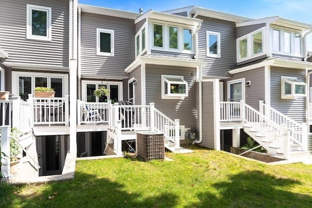 23 Indian Cove Way Unit 23, Easton, MA 02375 - rear view of house with stairs, a yard, and a wooden deck