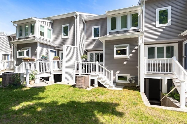 23 Indian Cove Way Unit 23, Easton, MA 02375 - back of property with stairway, a yard, and a deck